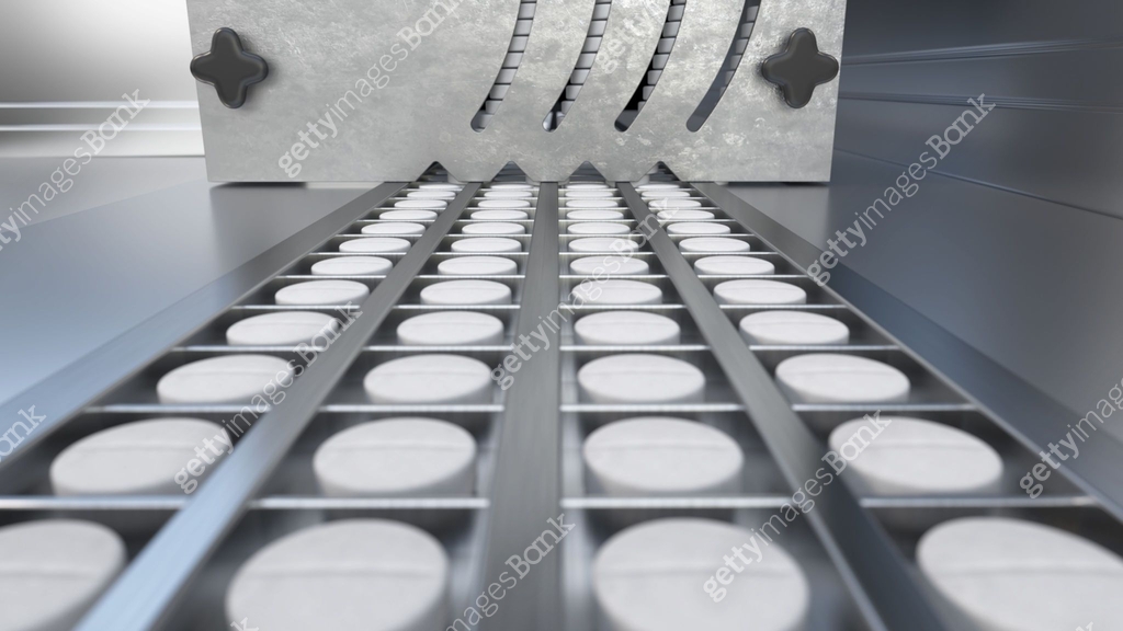 Industrial pill production process at a pharmaceutical facility in a ...