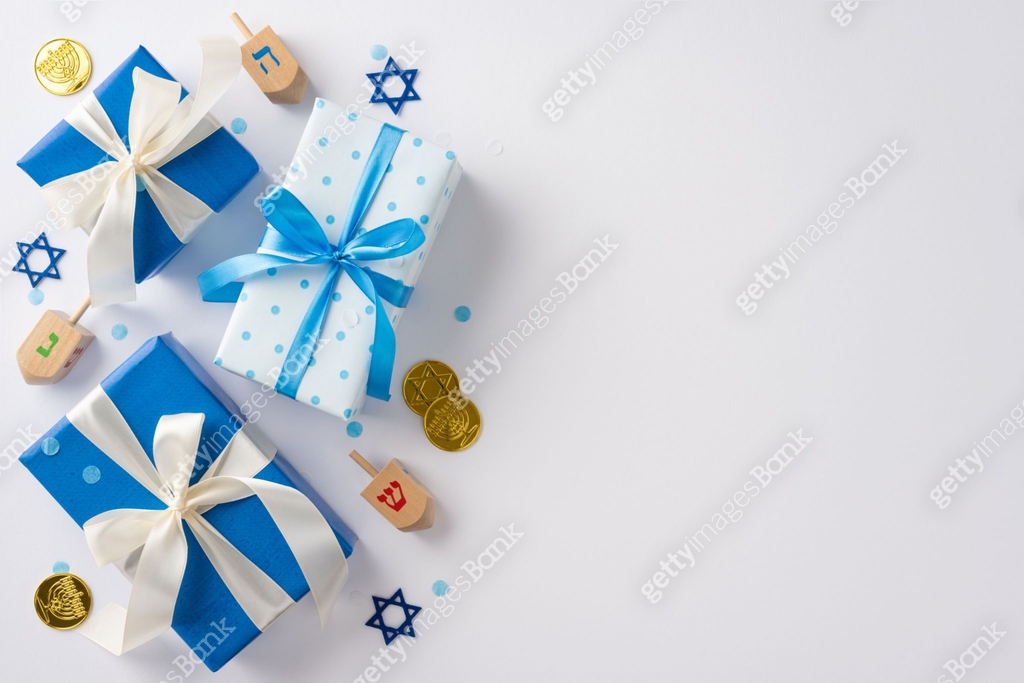 Top view of Hanukkah gifts with blue and white ribbons surrounded by ...