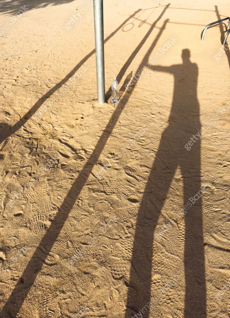 shadow silhouette of unrecognizable person in public calisthenics park ...