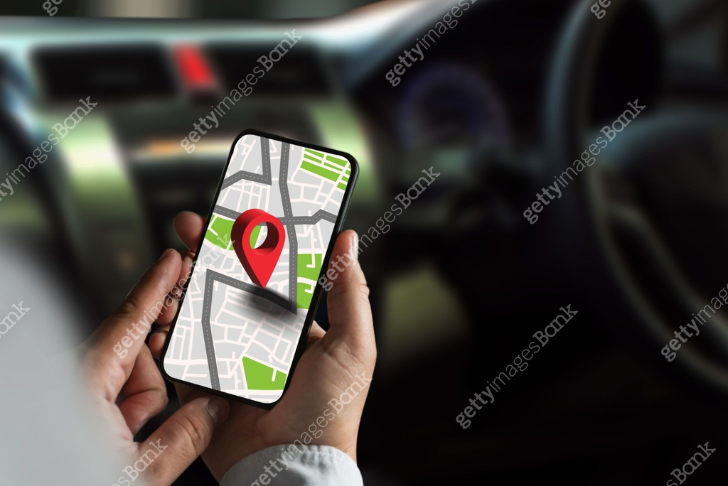 gps map ,man using a smartphone displaying a map in a car gps ...