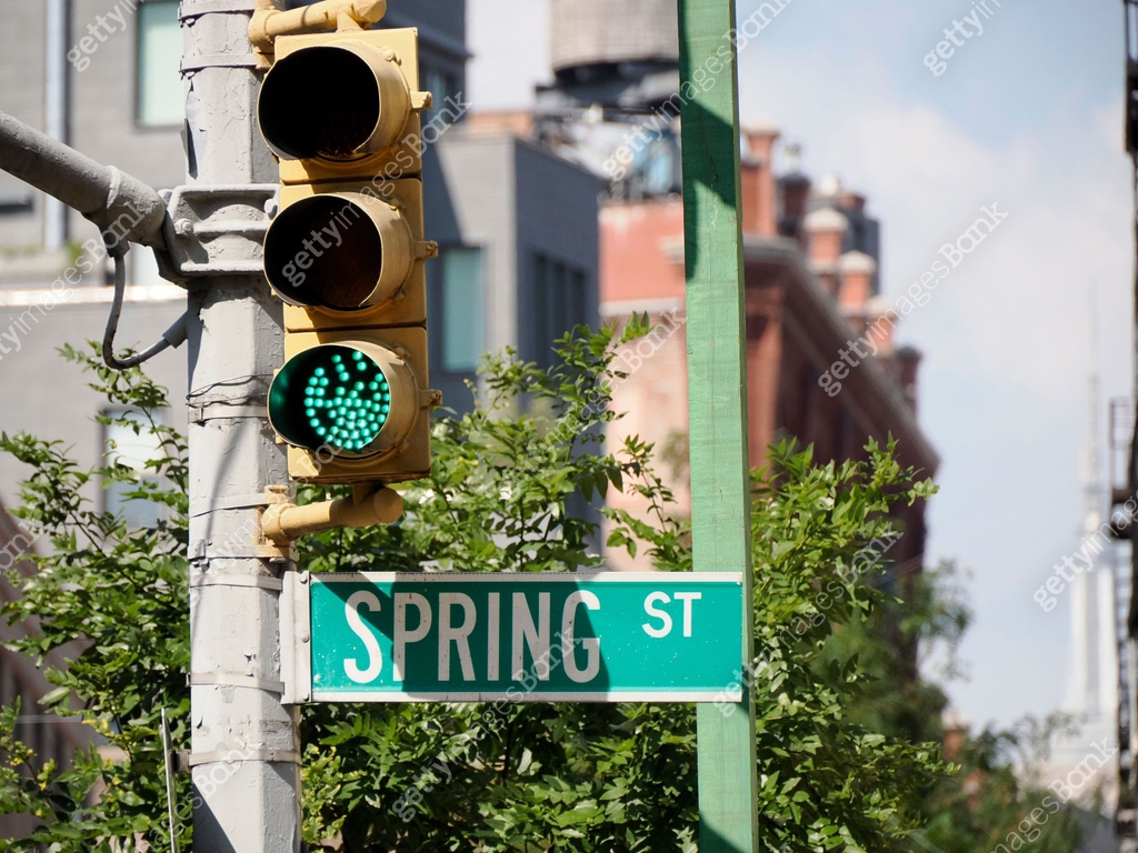 Spring street sign in New York City Little Italy district buildings ...
