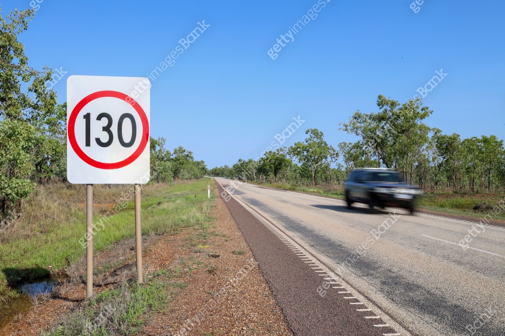 130 km/h road sign. Motion blur of passing speeding vehicle. Northern ...