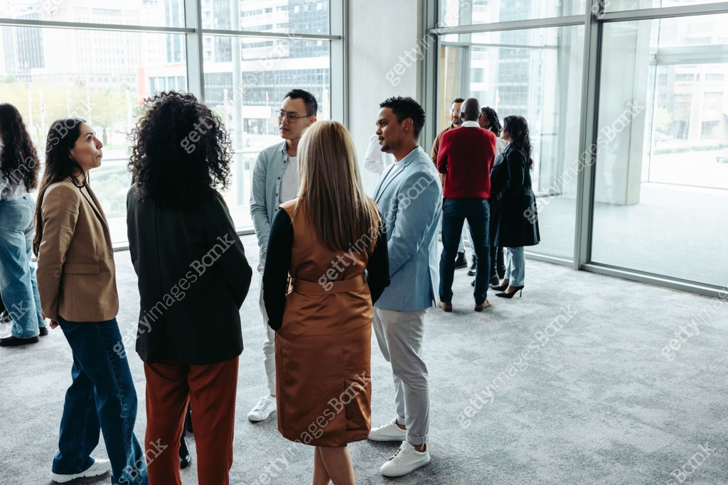 Group of professionals networking during a conference at a modern ...