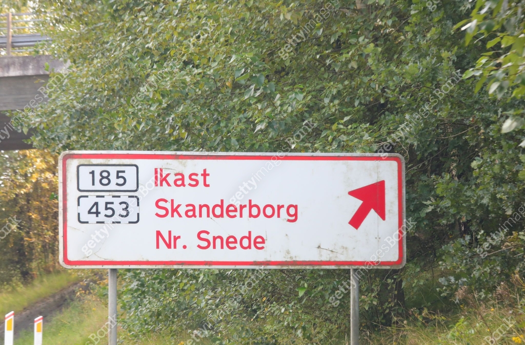 Danish Rode12 road sign in Denmark with directions to Danish destinations and a red ...