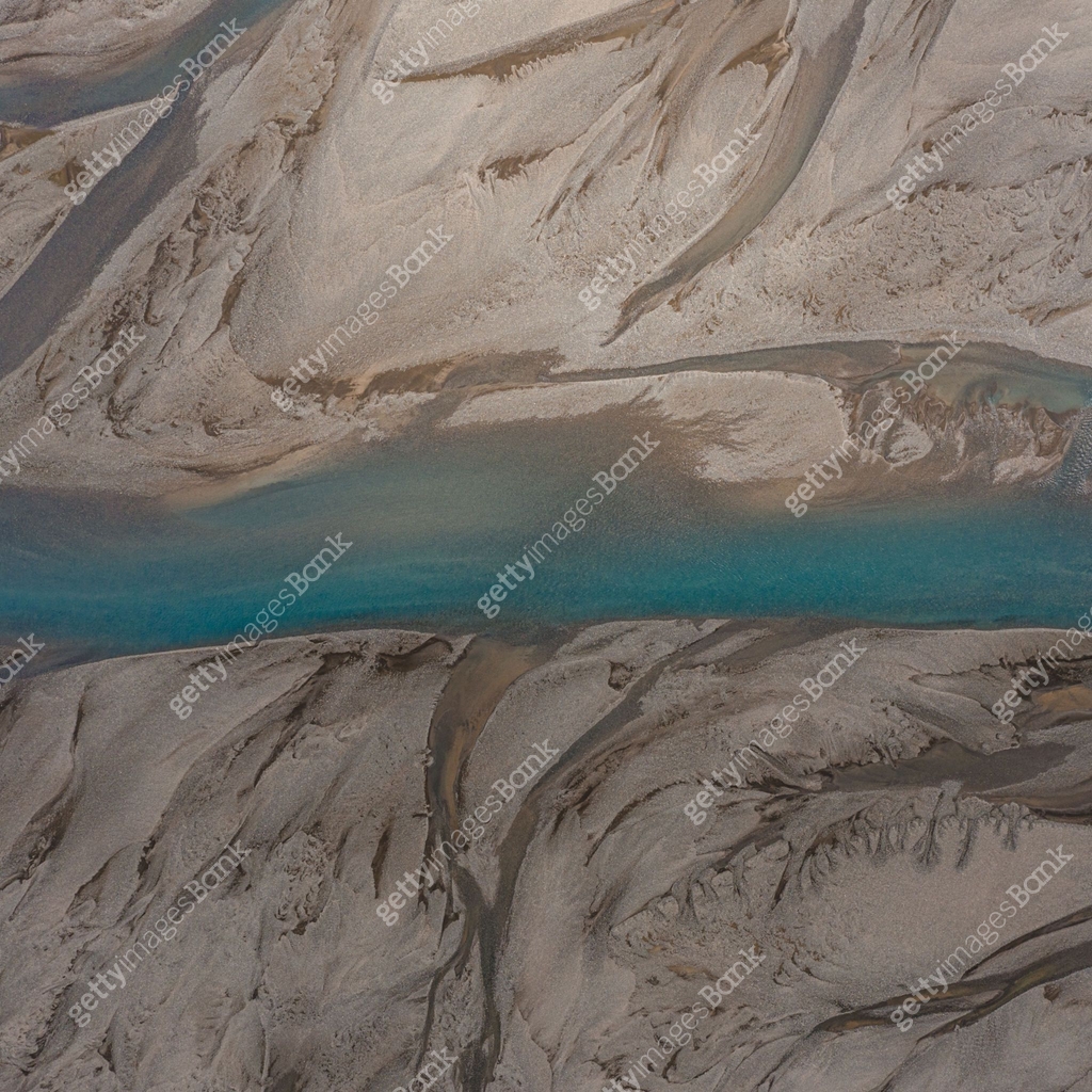 Contorted River Pattern Aerial view of glacial river patterns with vivid blue water in ...