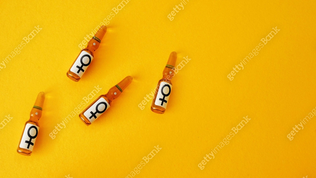 Vials with female symbol, hormones injections, concept hormone ...