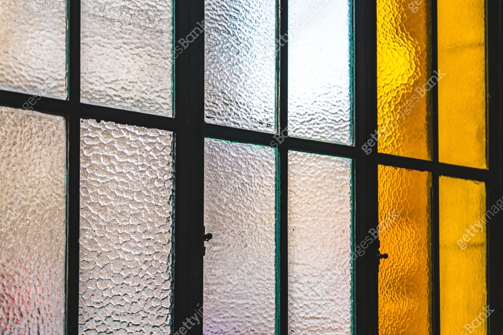 Textured and colored glass window panes creating a unique pattern 이미지 ...
