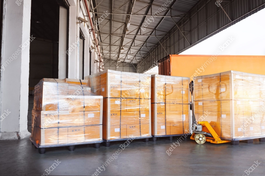 Pallet Container Loading Bulk of Pallets Boxes Loading into Shipping Container. Package Boxes ...