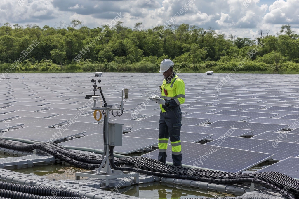 Engineer Checking and working setup Floating solar panels or solar cell ...