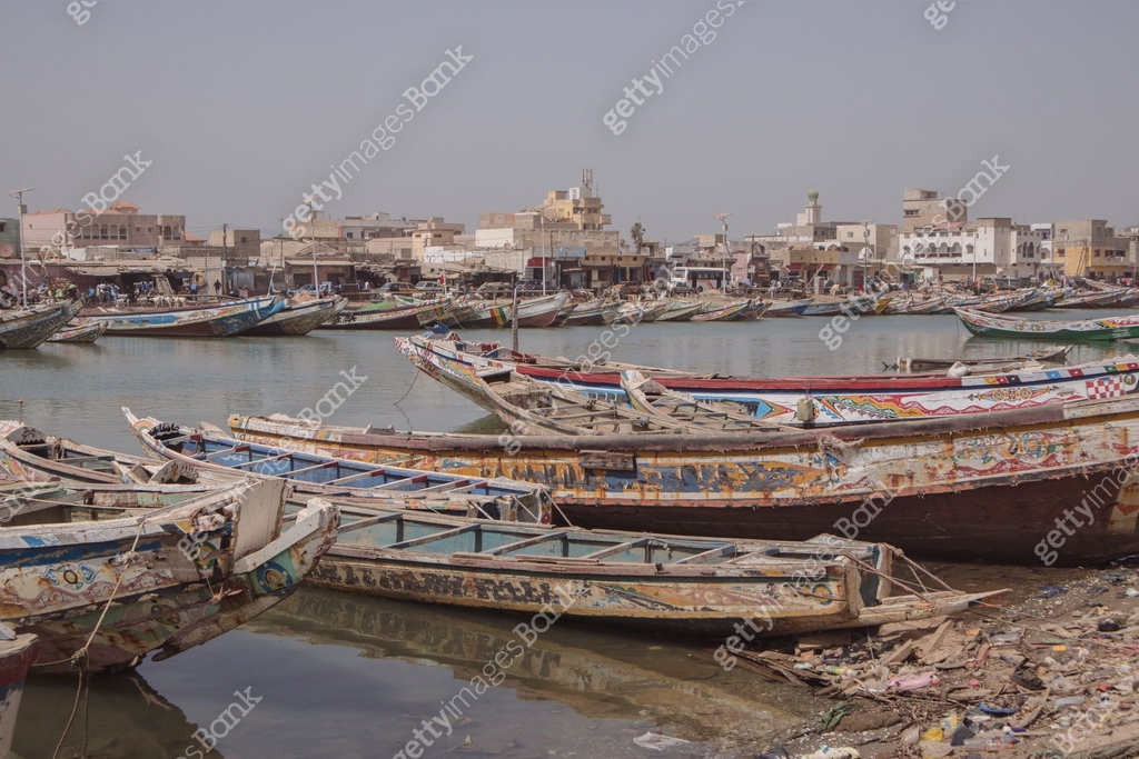 Sengal Mathil Fishing boats parked on the shore in Sant Louis, a city in northern ...