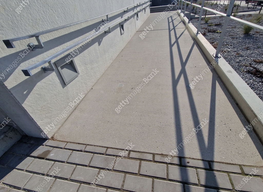 wheelchair ramp and stairs on the other side. height differences are ...