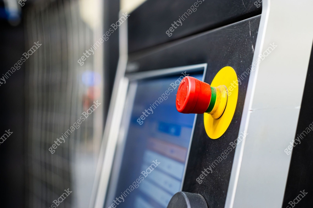 Close up of red button in production, emergency stop. Safety button in ...