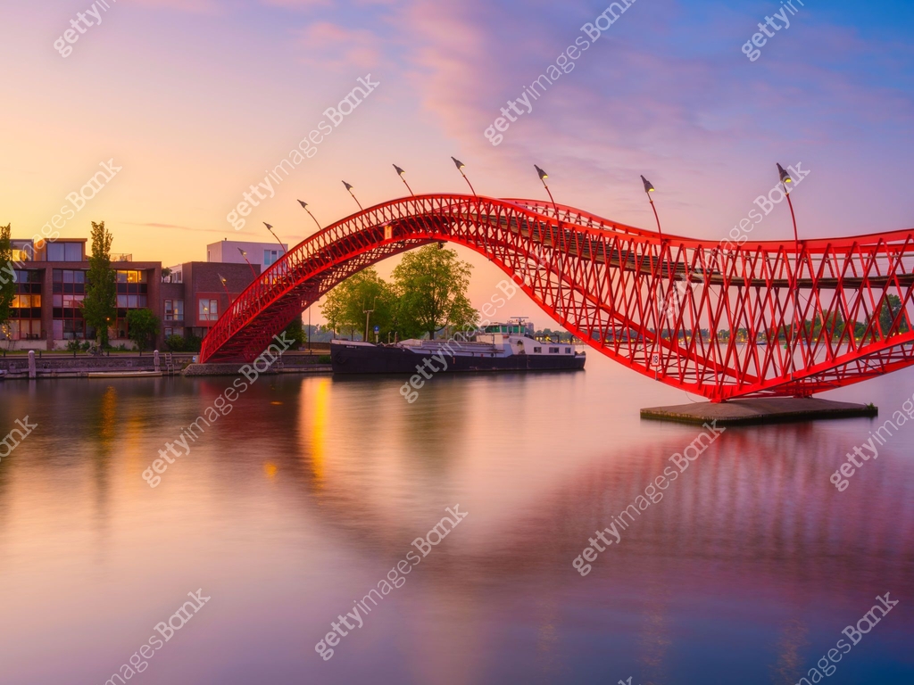 Python Bridge Night The Python Bridge, Amsterdam, the Netherlands. The bridge on the blue ...