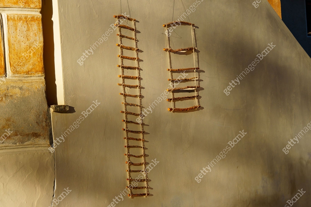 Two rope ladders (decorative trellis, climbing aid) on a light-coloured ...