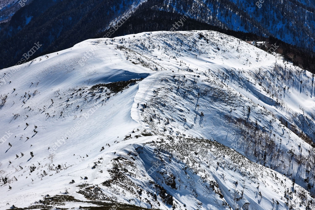 Snow Capped Ridge Snow-capped ridge of Mount Nishihotaka in the Northern Alps in Japan ...