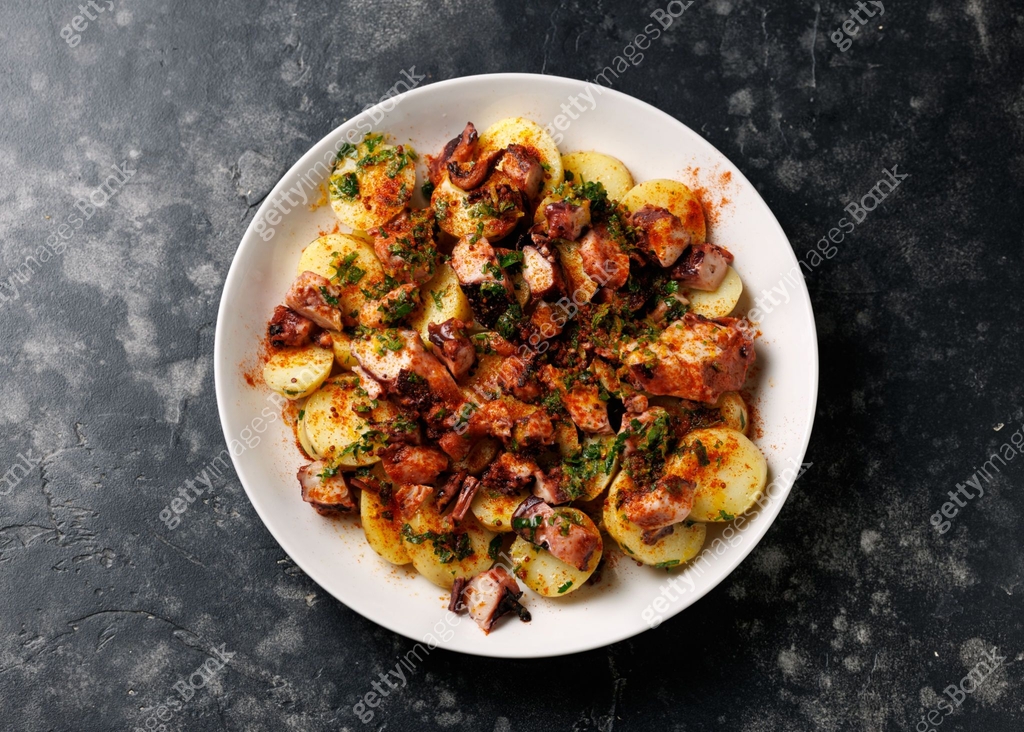 Octopus tentacles and new potatoes warm salad with smoked paprika ... Octopus tentacles and new potatoes warm salad with smoked paprika ...
