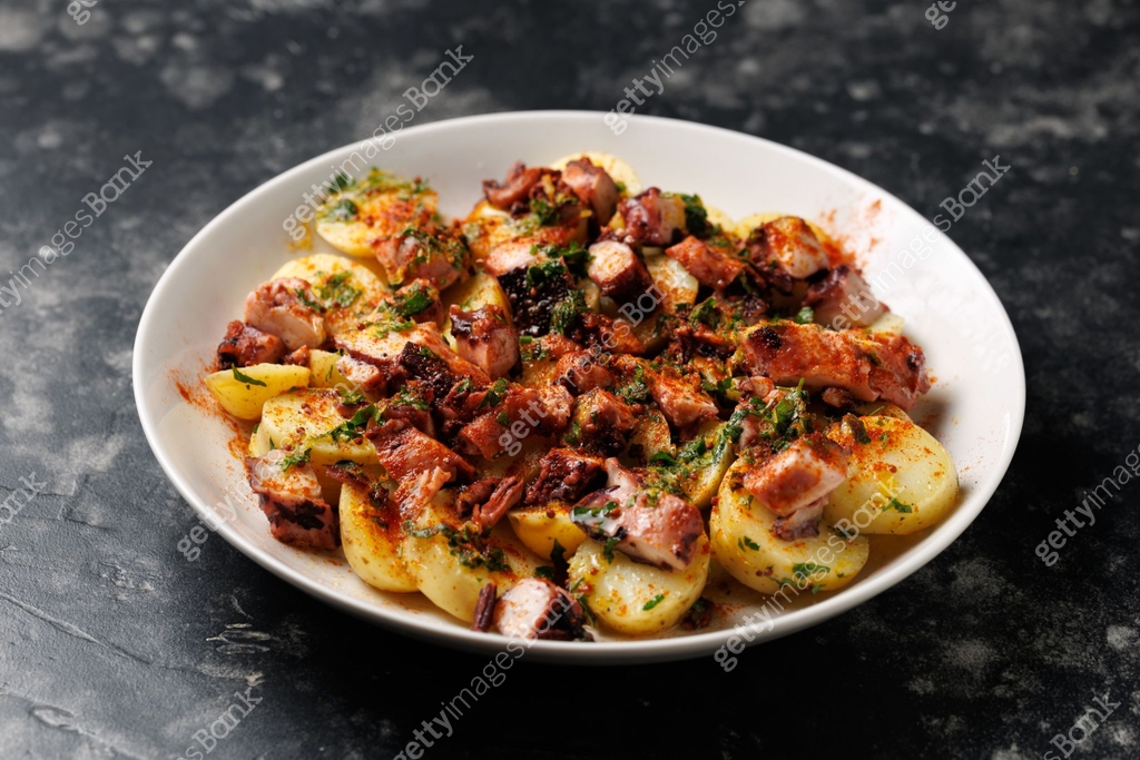 Octopus tentacles and new potatoes warm salad with smoked paprika ... Octopus tentacles and new potatoes warm salad with smoked paprika ...