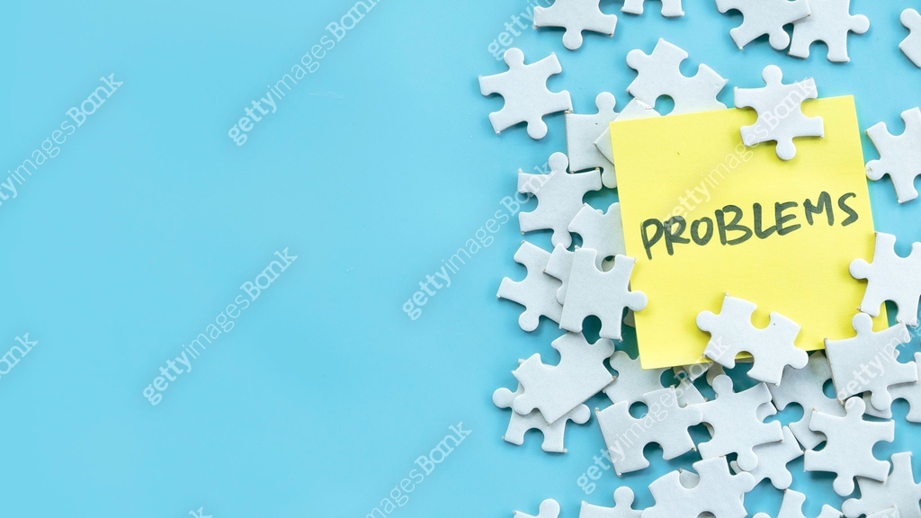 Scattered Puzzle Pieces with Yellow Sticky Note Reading Problems on ...