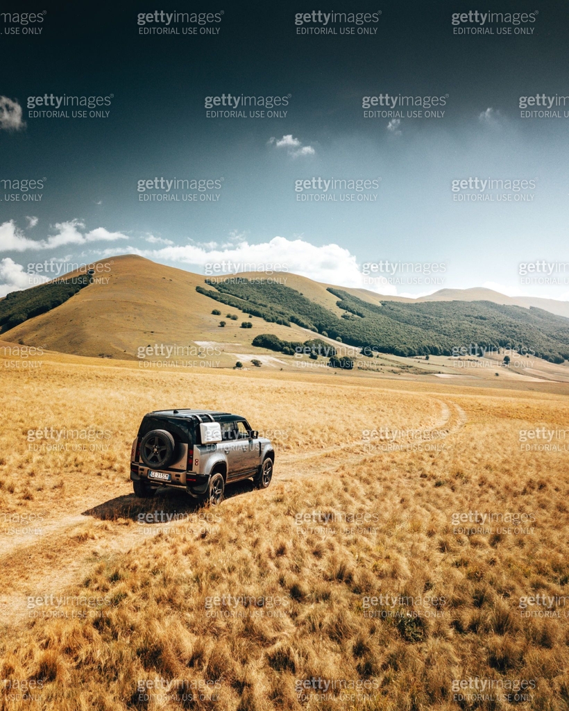 Aerial view of the New Land Rover Defender in the dry italian ...