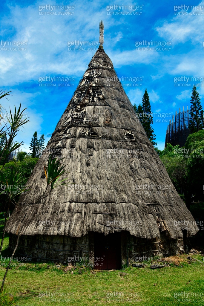 Kanak great house - conical building with thatched roof and finial ...