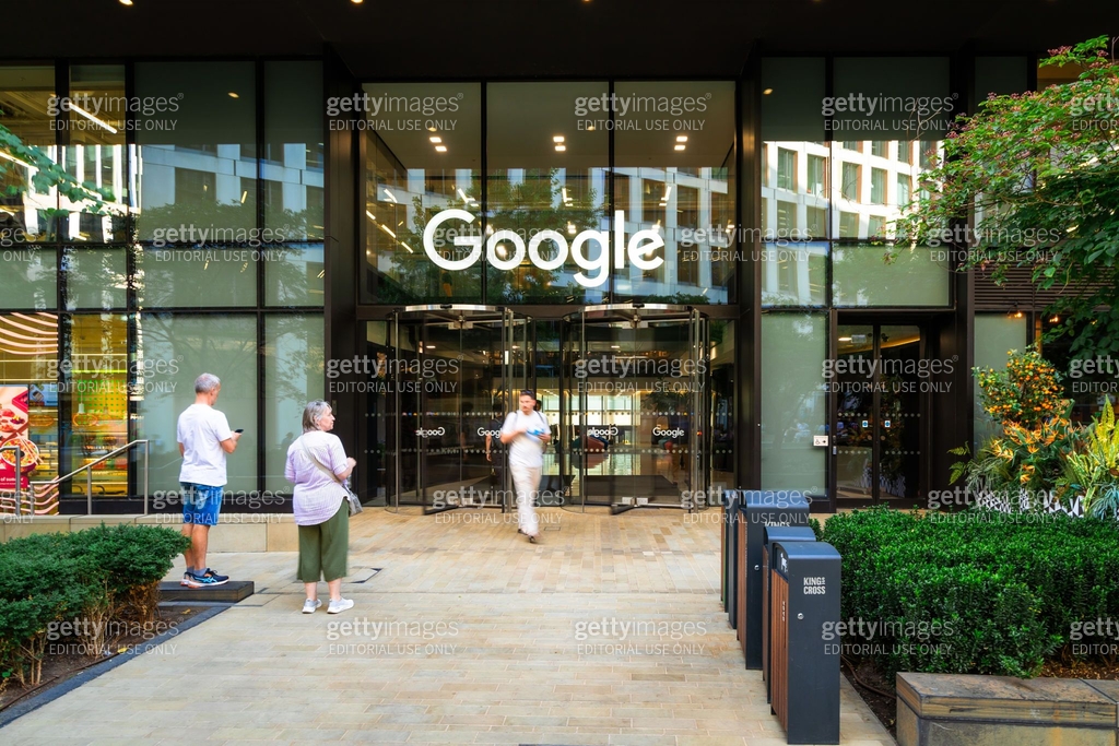 Google Outside Blurred motion of people outside Google headquarters at King's Cross in ...