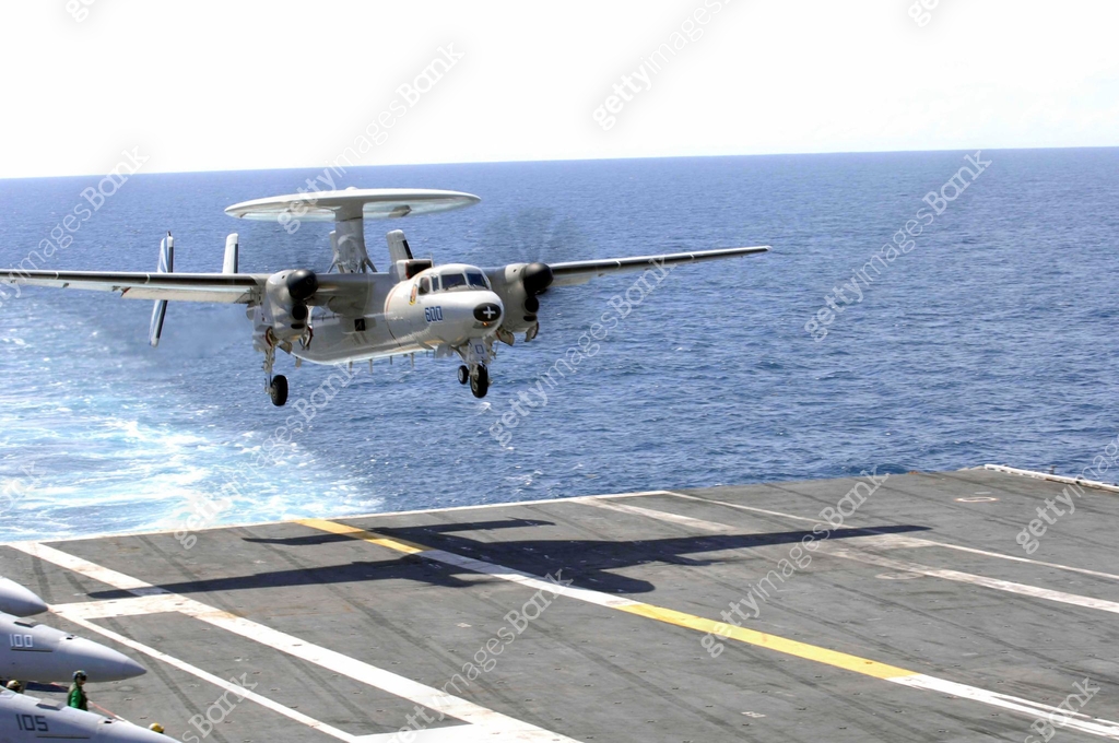 An E-2C Hawkeye makes its approach to the flight deck of USS Dwight D ...