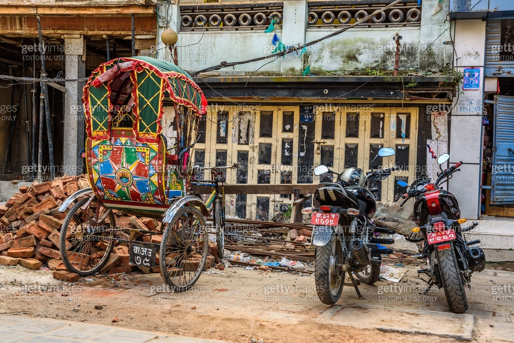 Motorcycle Recshaw Rickshaw and motorcycles parked in front of damaged houses 이미지 ...