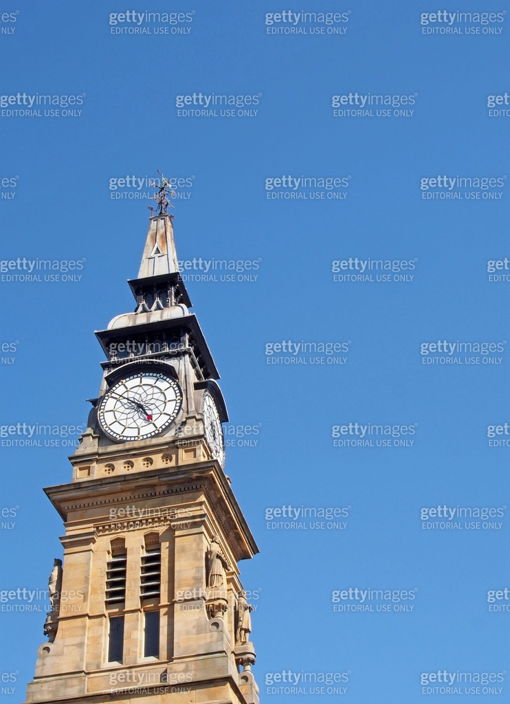 the ornate clock tower of the historic 19th century atkinson building ...