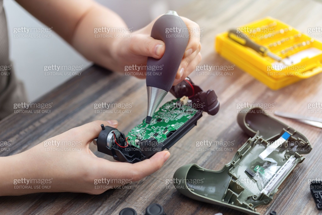 Clean Game Controller Close up of disassemble game controller repairing, cleaning or ...