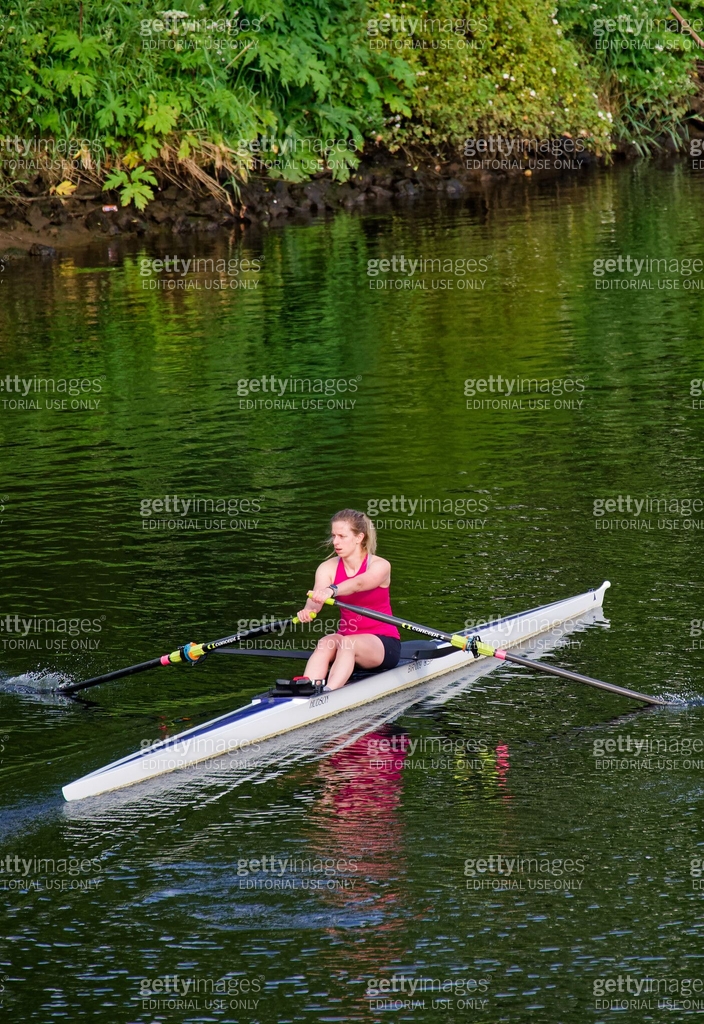 Easy Rider Rowing Canoe Women training on canoe to practise rowing during early morning on ...