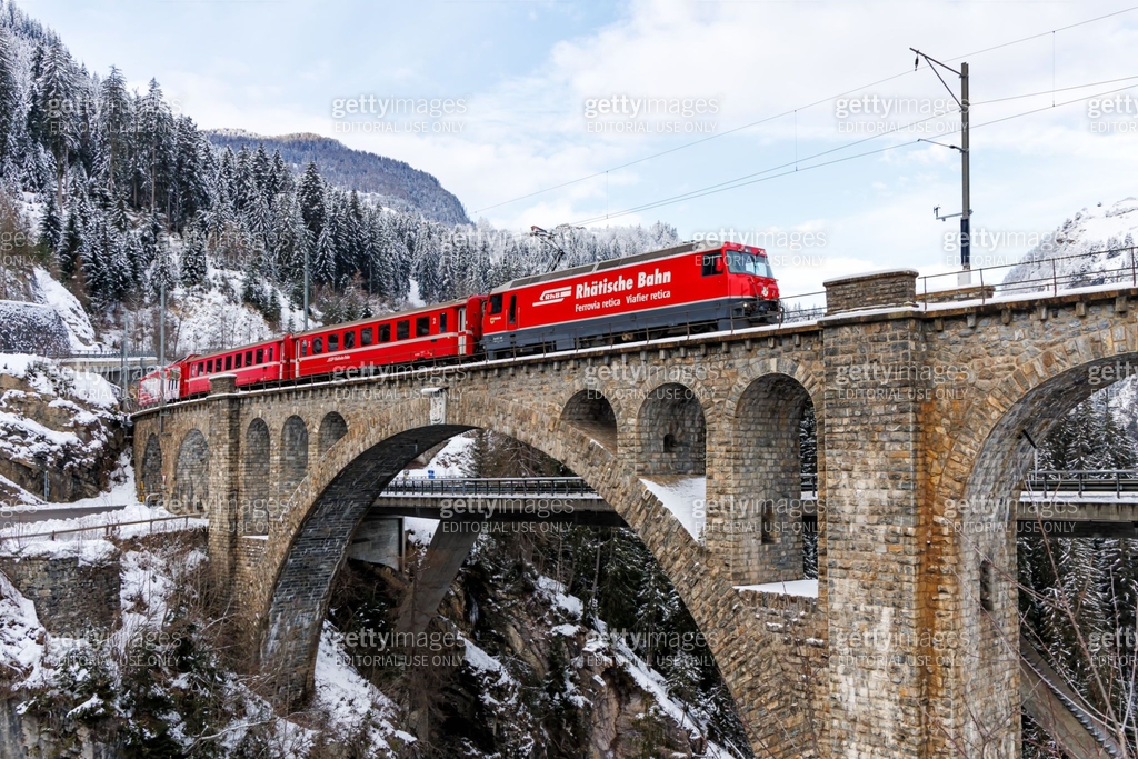 Rhaetian Railway passenger train at the Soliser Viaduct on Albula line ...