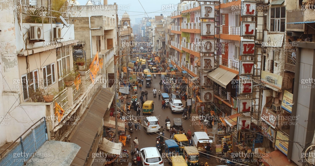 Traffic On The Main Bazar road Street Paharganj. Cars, Motorcycles ...