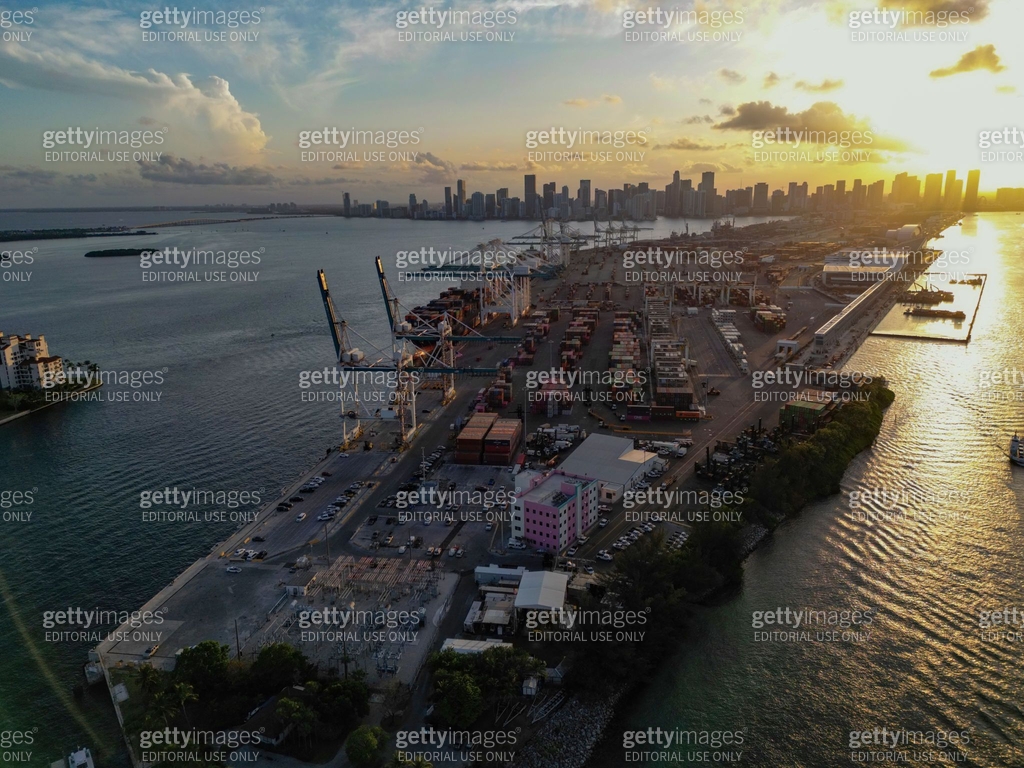 Container terminal with stored cargo and port equipment. Miami beach ...