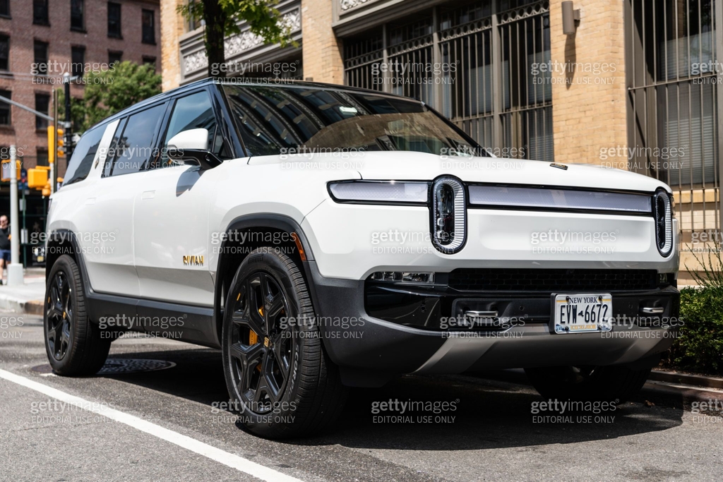 Rivian R1S SUV electric white car view from the front and passenger ...