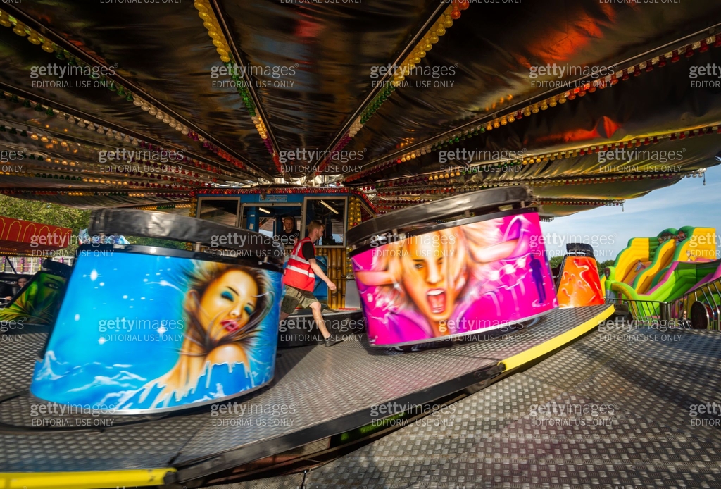 Classic fairground Waltzer ride at traditional British funfair in ...