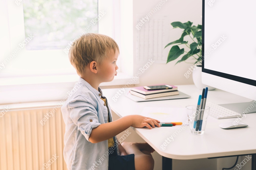 Preschool child using computer technology in early development or ...