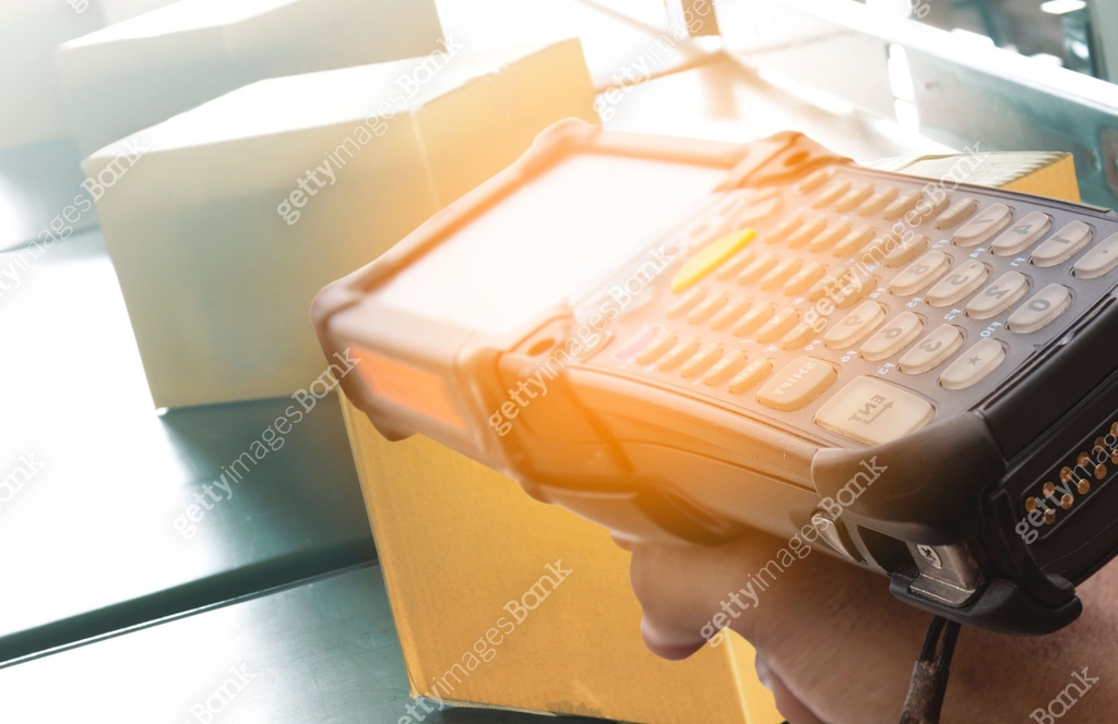 Worker scanning barcode scanner on shipment boxes, Manufacturing cargo ...