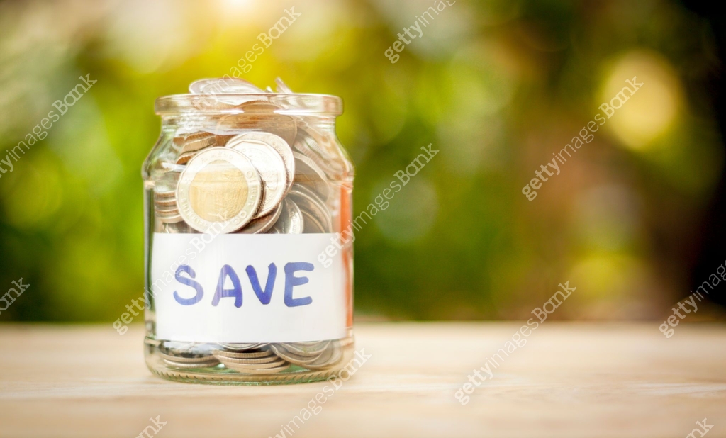 Coin Save Full coins in a jar. Saving money. Growing concept. Save money for ...