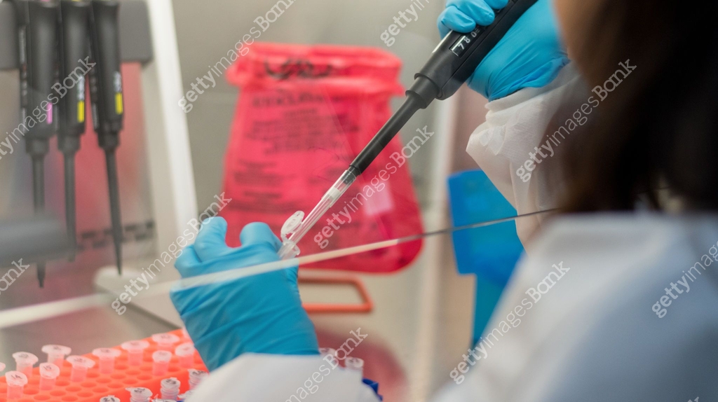 Scientist or lab worker hand in glove using pipette dropper dropping ...