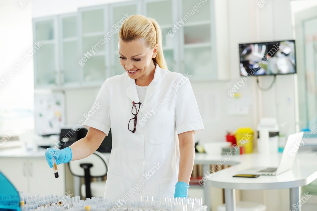 Lab Assistant Uniform Attractive blond lab assistant in white sterile uniform, with ...