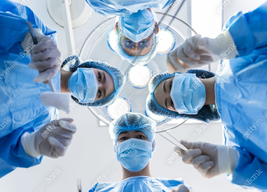 Medical Team Performing Surgical Operation in hospital operating ...