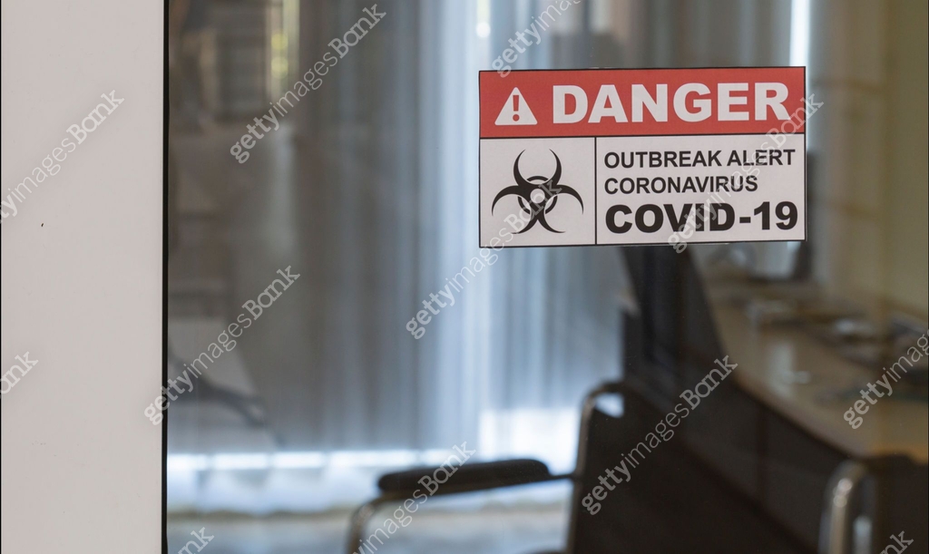 Outbreak alert signage in front of control area, quarantine room ...