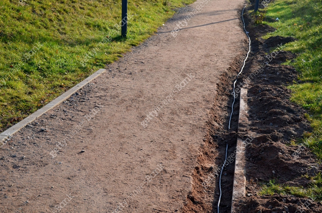 Gutter Path the path in the park is interrupted by a shallow excavation of a gutter ...