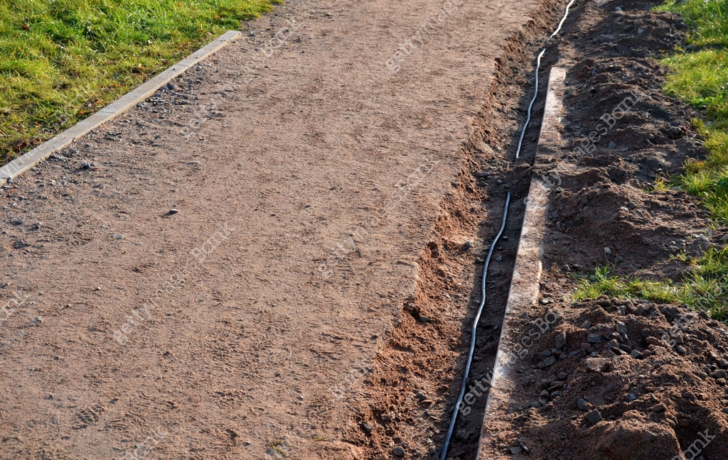 Gutter Path the path in the park is interrupted by a shallow excavation of a gutter ...