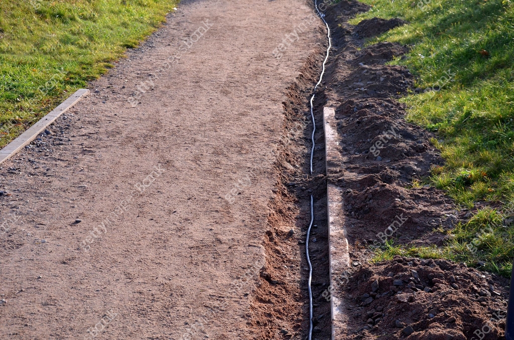 Gutter Path the path in the park is interrupted by a shallow excavation of a gutter ...