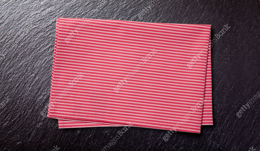 Red table cloth. Stack of colorful dish towels on desk 이미지 (1294438582 ...