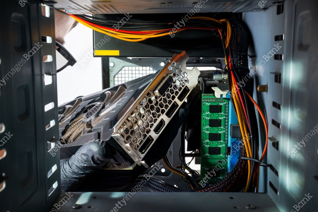 Gpu Inside Computer Case technician worker installing gpu graphics card to a desktop pc case ...