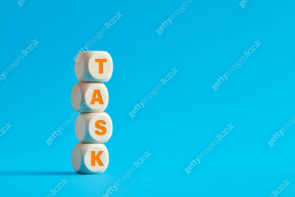 The word task on tiered wooden cubes on blue background. Task ...