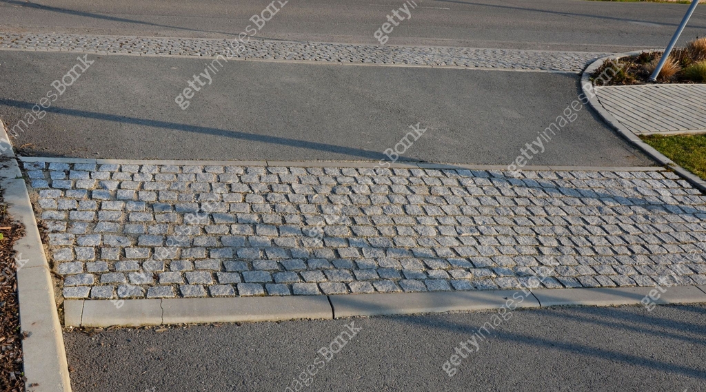 safety ramp for slowing down traffic to a residential street where ...