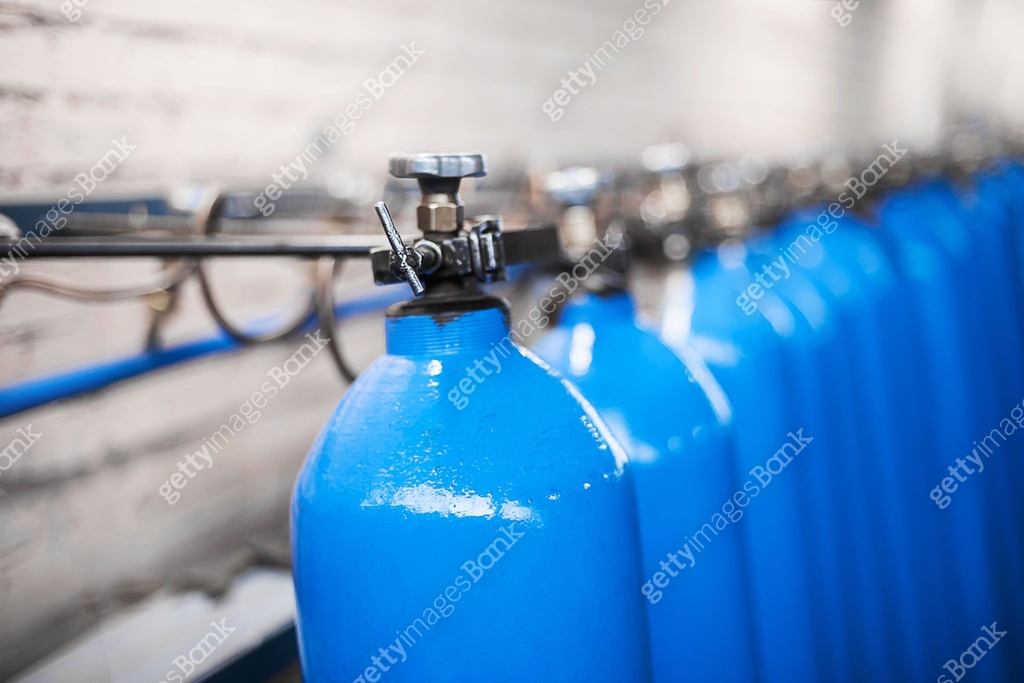 Oxygen cylinder with compressed gas. Blue Oxygen tanks for industry ...
